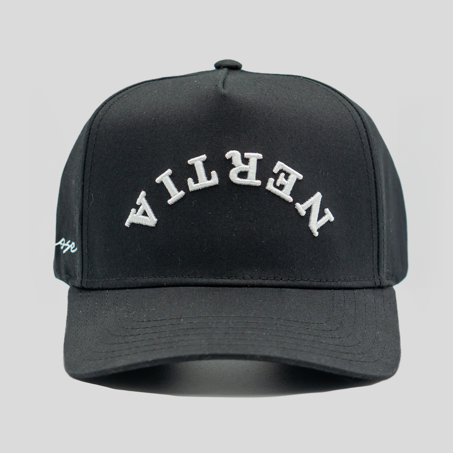 Black cap with white text on a gray background