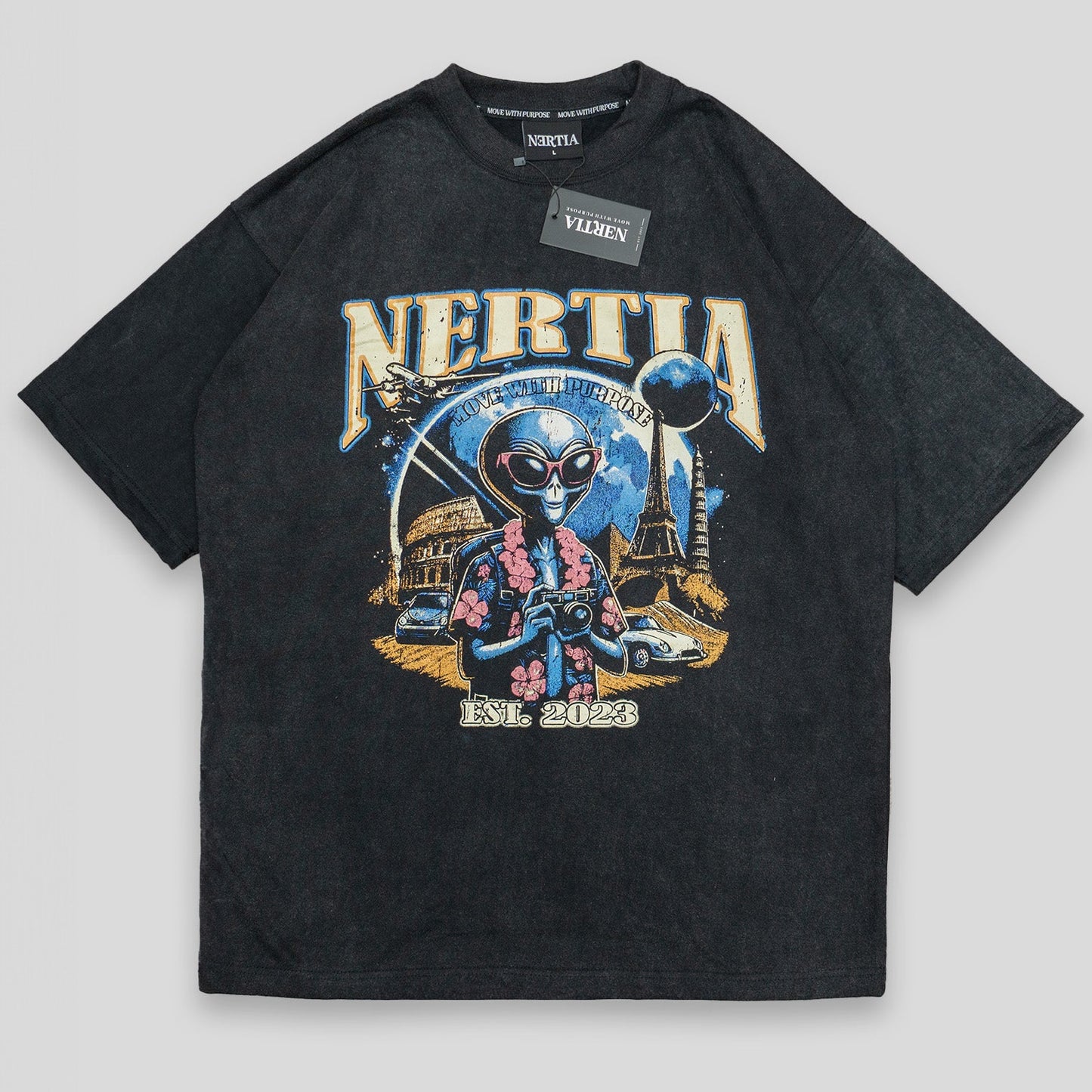 Black t-shirt with colorful graphic design and 'Nertia' branding on a light gray background