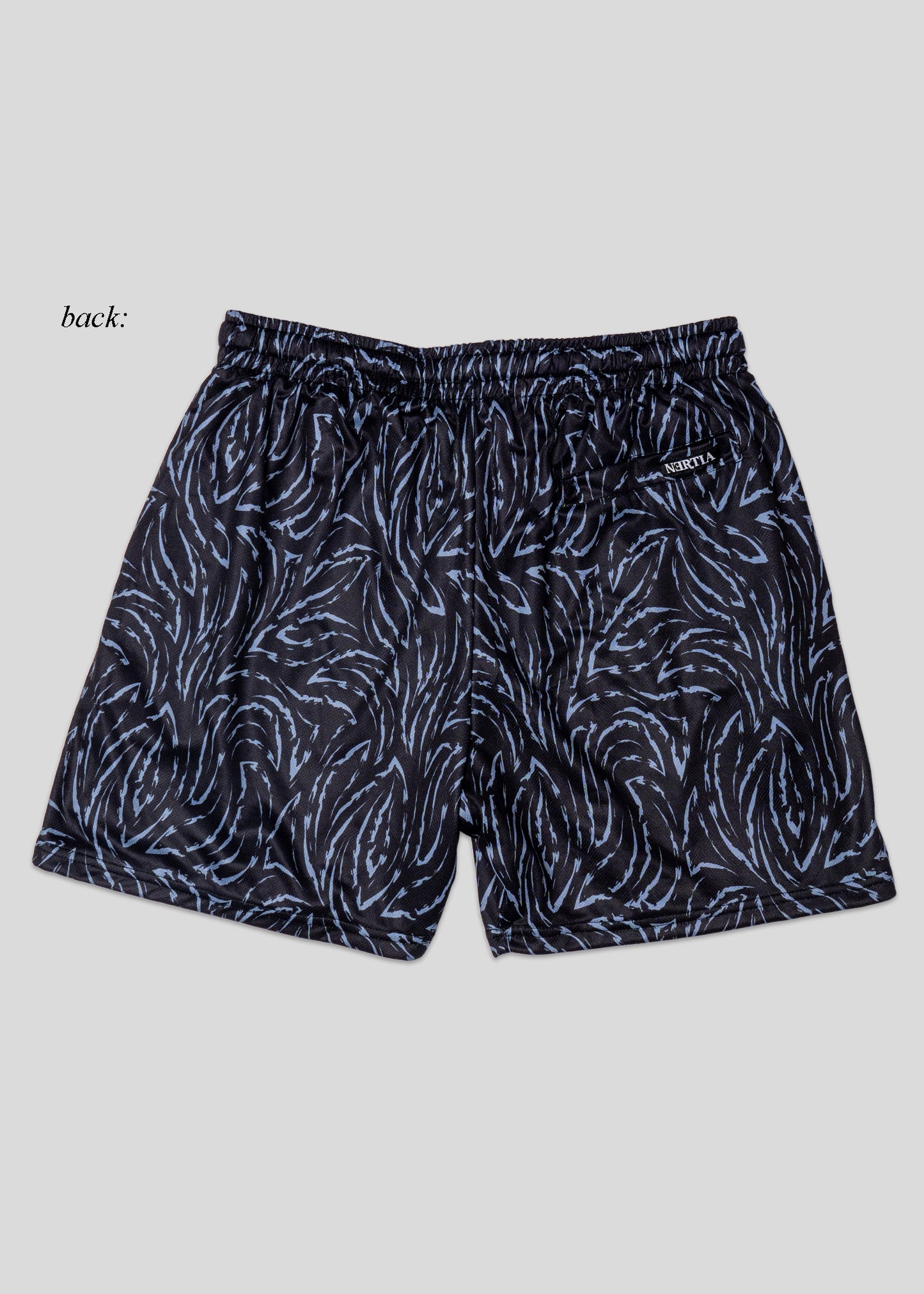 Black patterned shorts on a light gray background