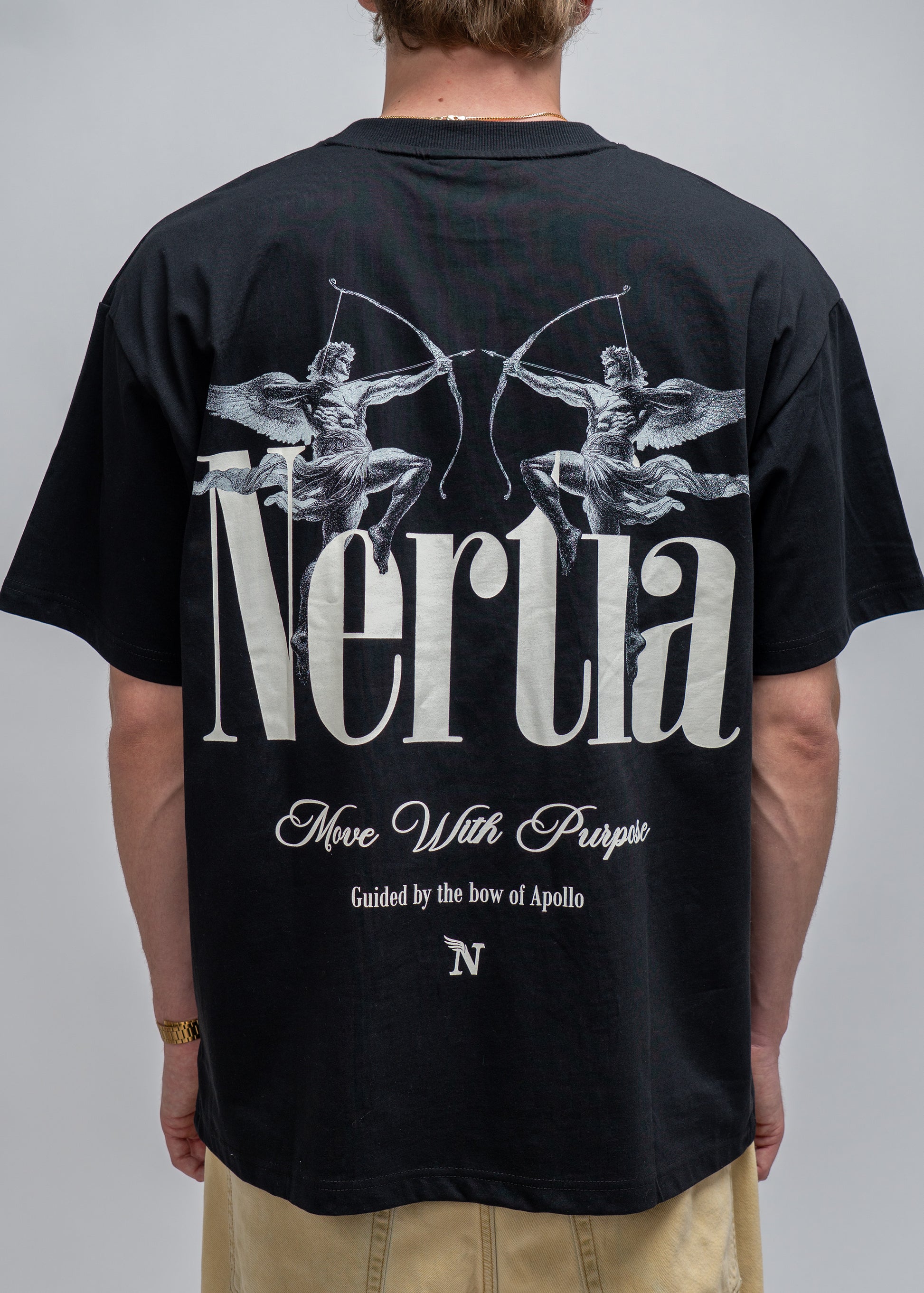 Black t-shirt with 'Nertia' design on the back, worn by a person against a gray background