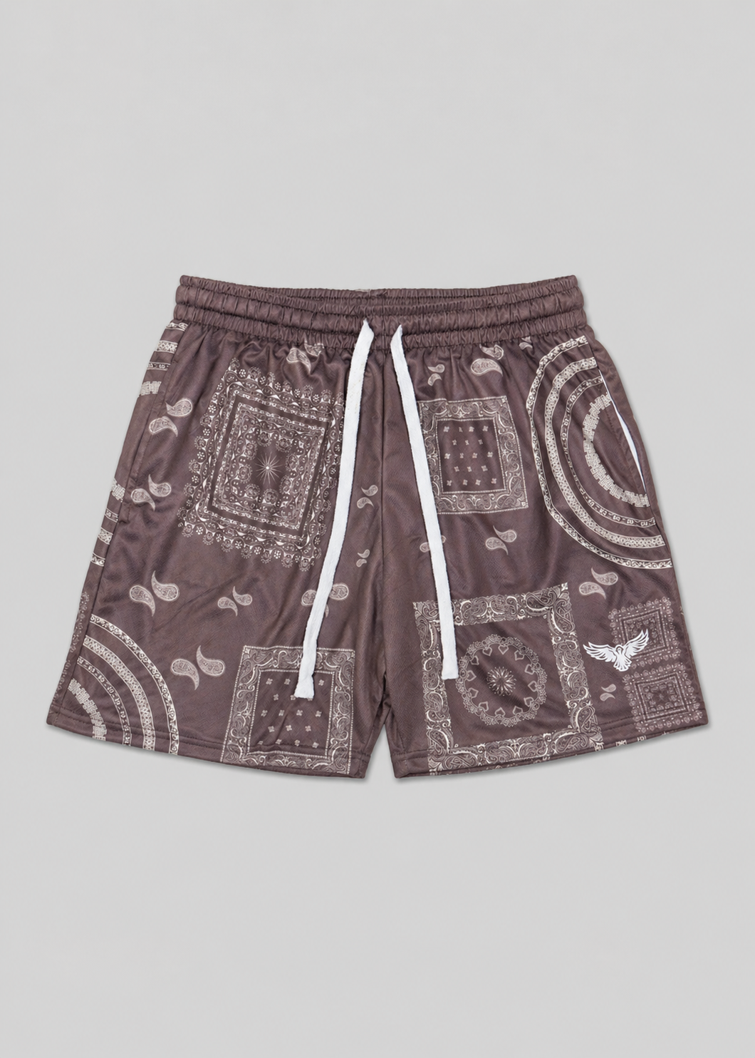 Brown shorts with white patterns on a light gray background