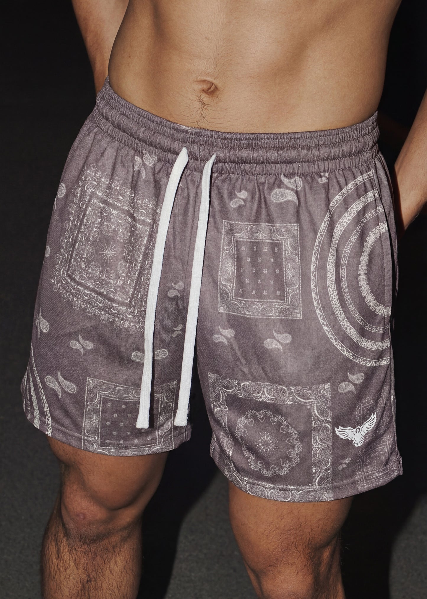 Patterned shorts with a drawstring on a dark background