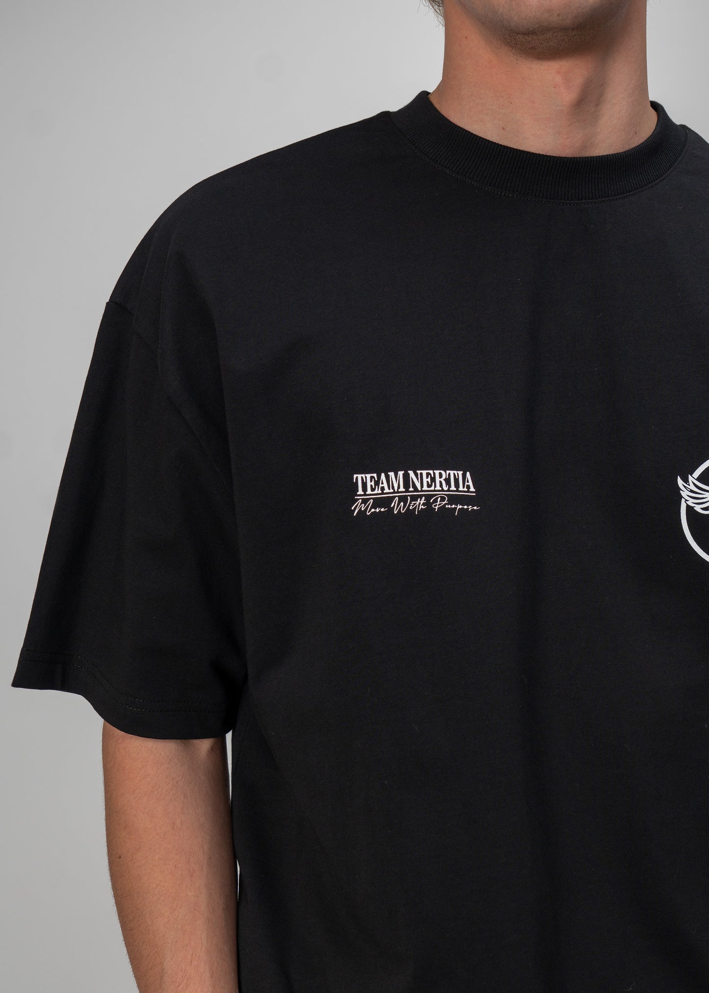 Black t-shirt with 'Team Nertia' text on a gray background