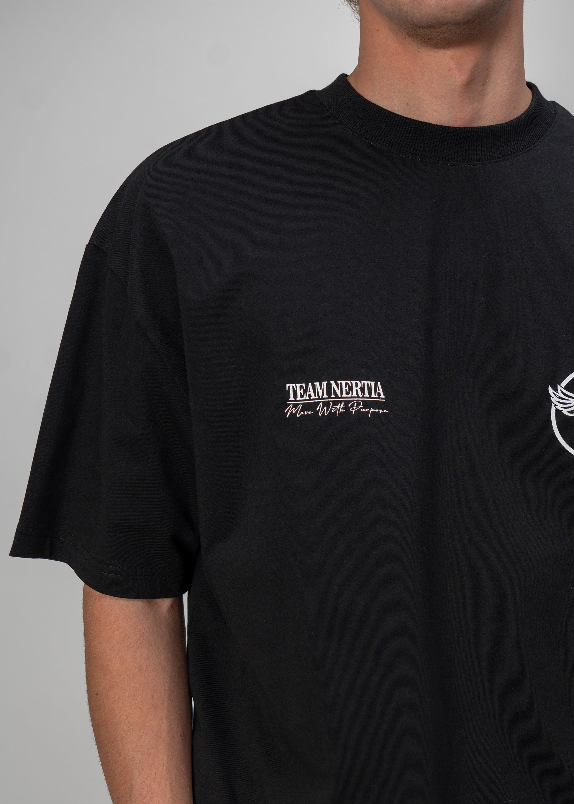 Black t-shirt with 'Team Nertia' text on a gray background