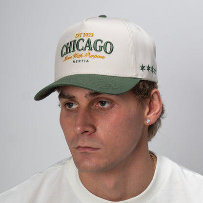 Man wearing a cap with 'Chicago' text on a gray background