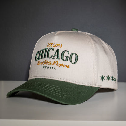 Beige and green cap with 'Chicago' and 'Hertia' text on a gray background