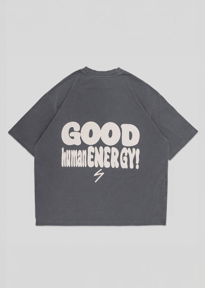 Gray t-shirt with 'GOOD human ENERGY!' text on the back against a light gray background