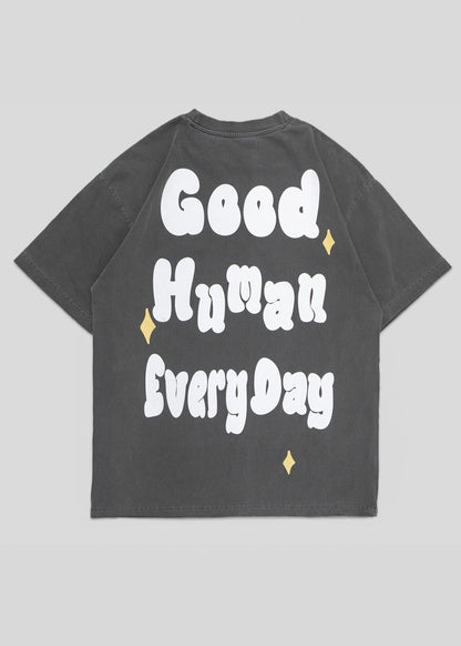 Gray t-shirt with 'Good Human Every Day' text on a gray background