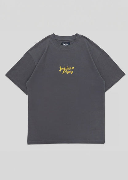 Gray t-shirt with yellow text on a light gray background