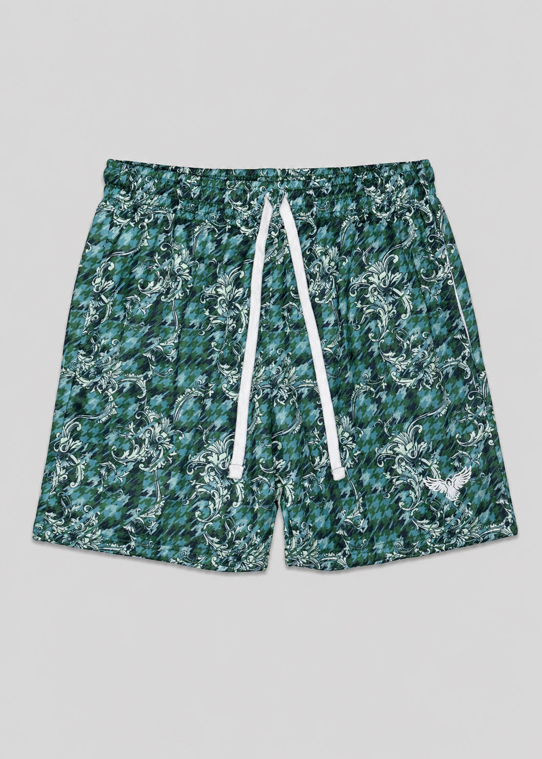Green patterned shorts with a white drawstring on a gray background