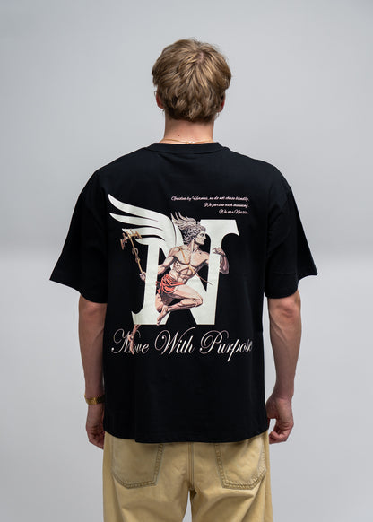 Person wearing a black t-shirt with a graphic design on the back, standing against a plain background.