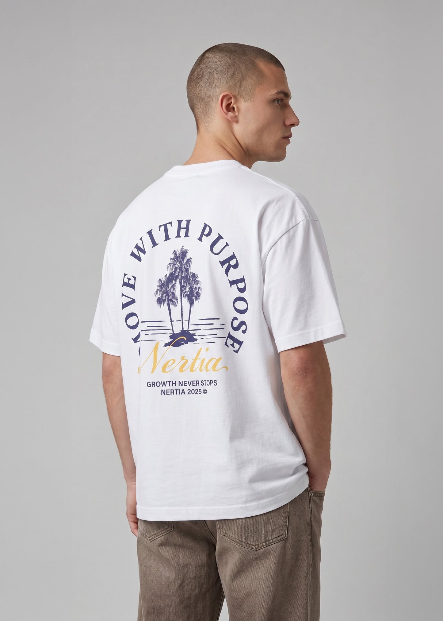 Person wearing a white t-shirt with text and graphics on the back, standing against a plain background