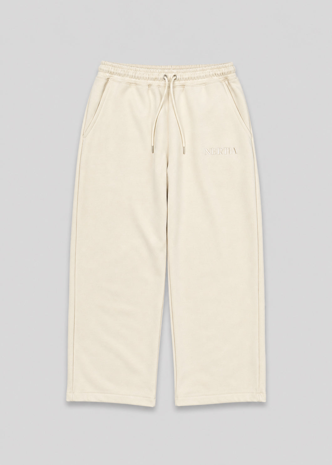 Beige pants with drawstring on a gray background