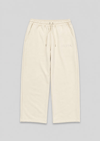 Beige pants with drawstring on a gray background