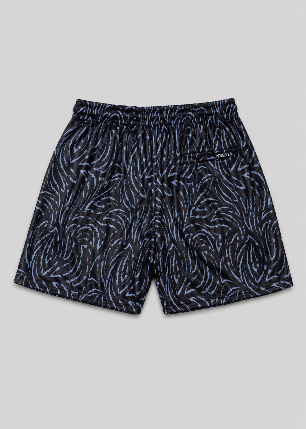 Black patterned shorts on a gray background