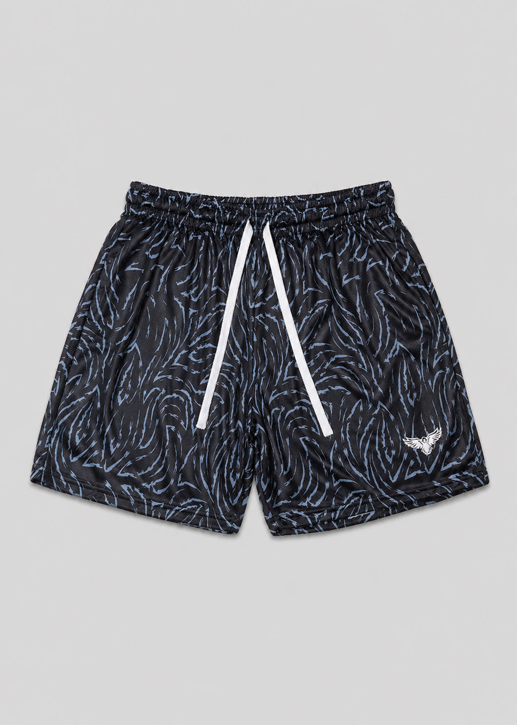 Black patterned shorts with white drawstrings on a gray background