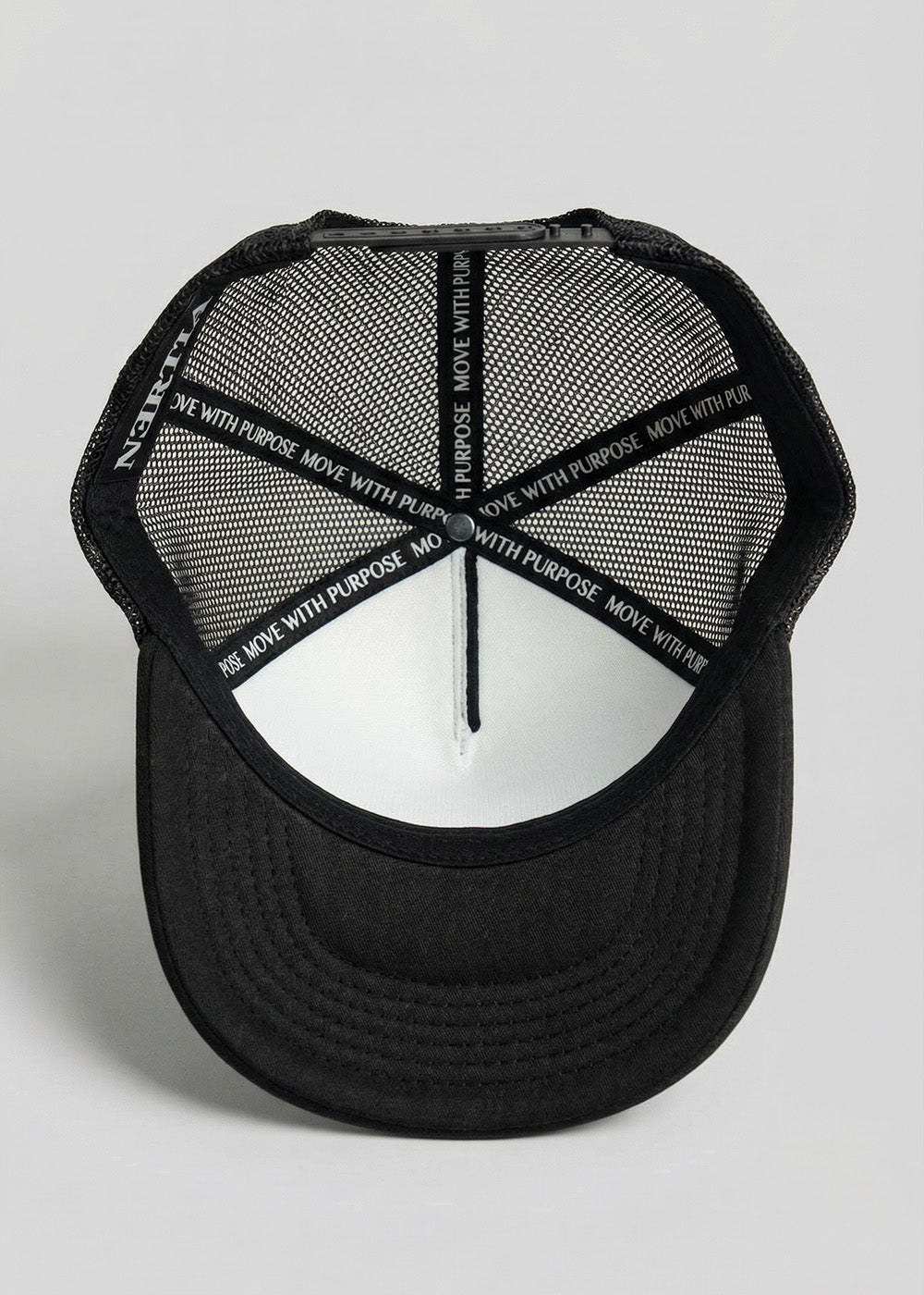 Black cap with mesh back and branding on a light gray background
