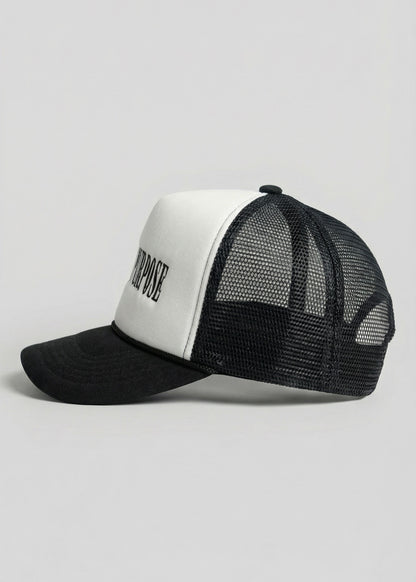 Black and white cap with mesh back on a light gray background