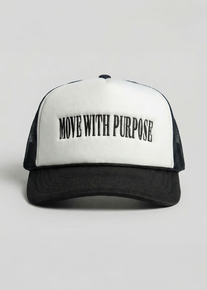 Black and white cap with 'Move with Purpose' text on a light gray background