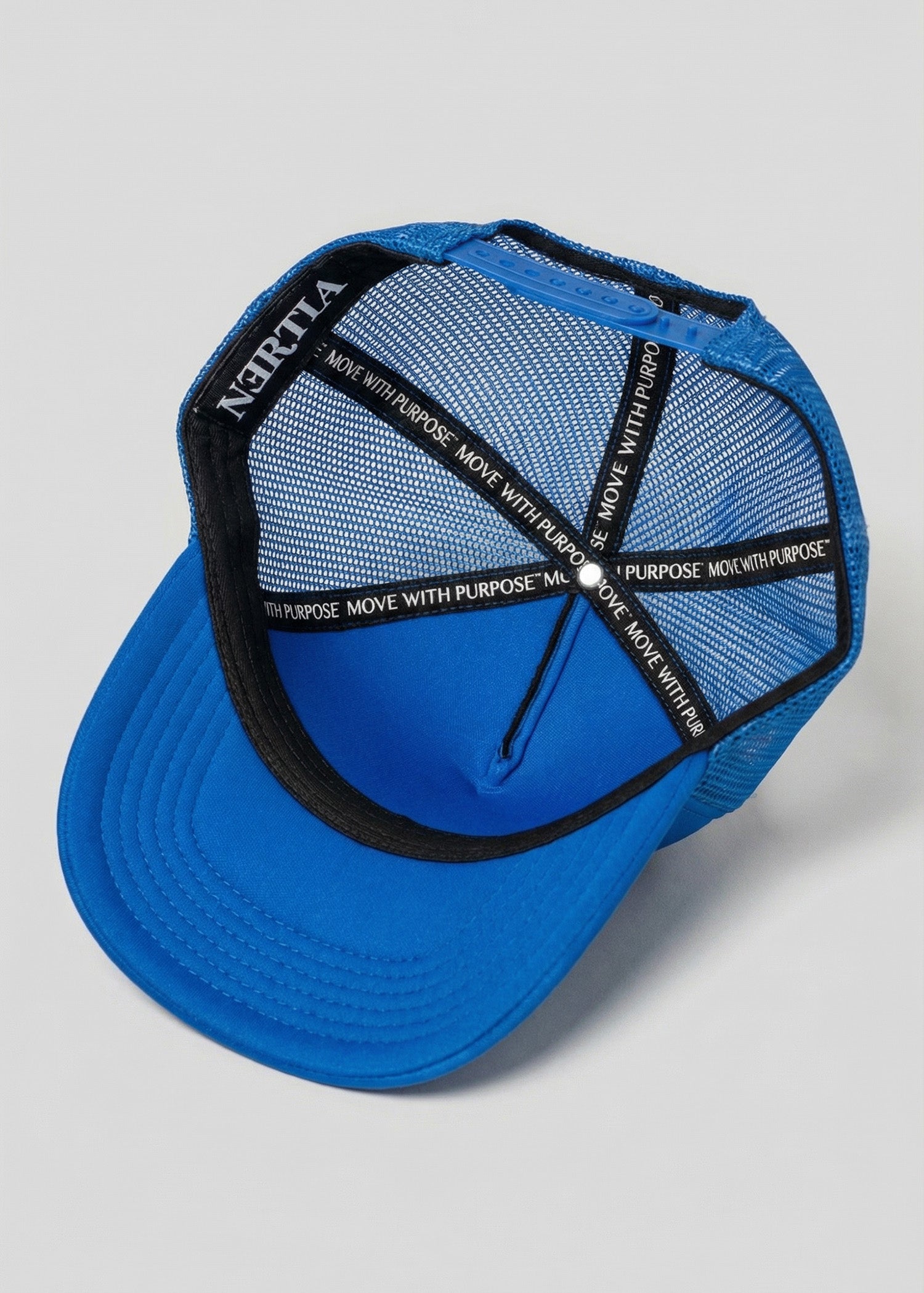 Blue cap with black mesh back and text on a gray background