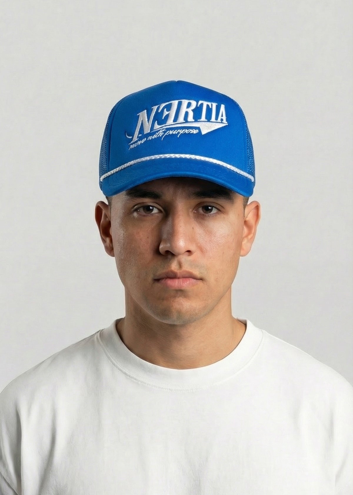 Person wearing a blue cap with 'N-Forta' branding against a plain background