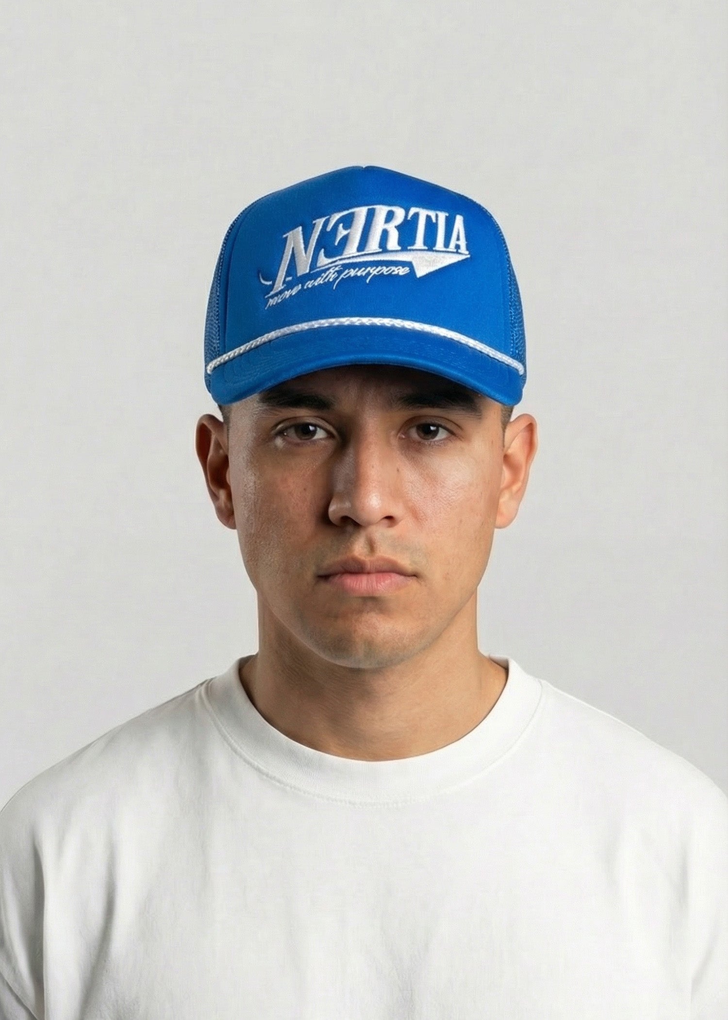 Person wearing a blue cap with 'N-Forta' branding against a plain background