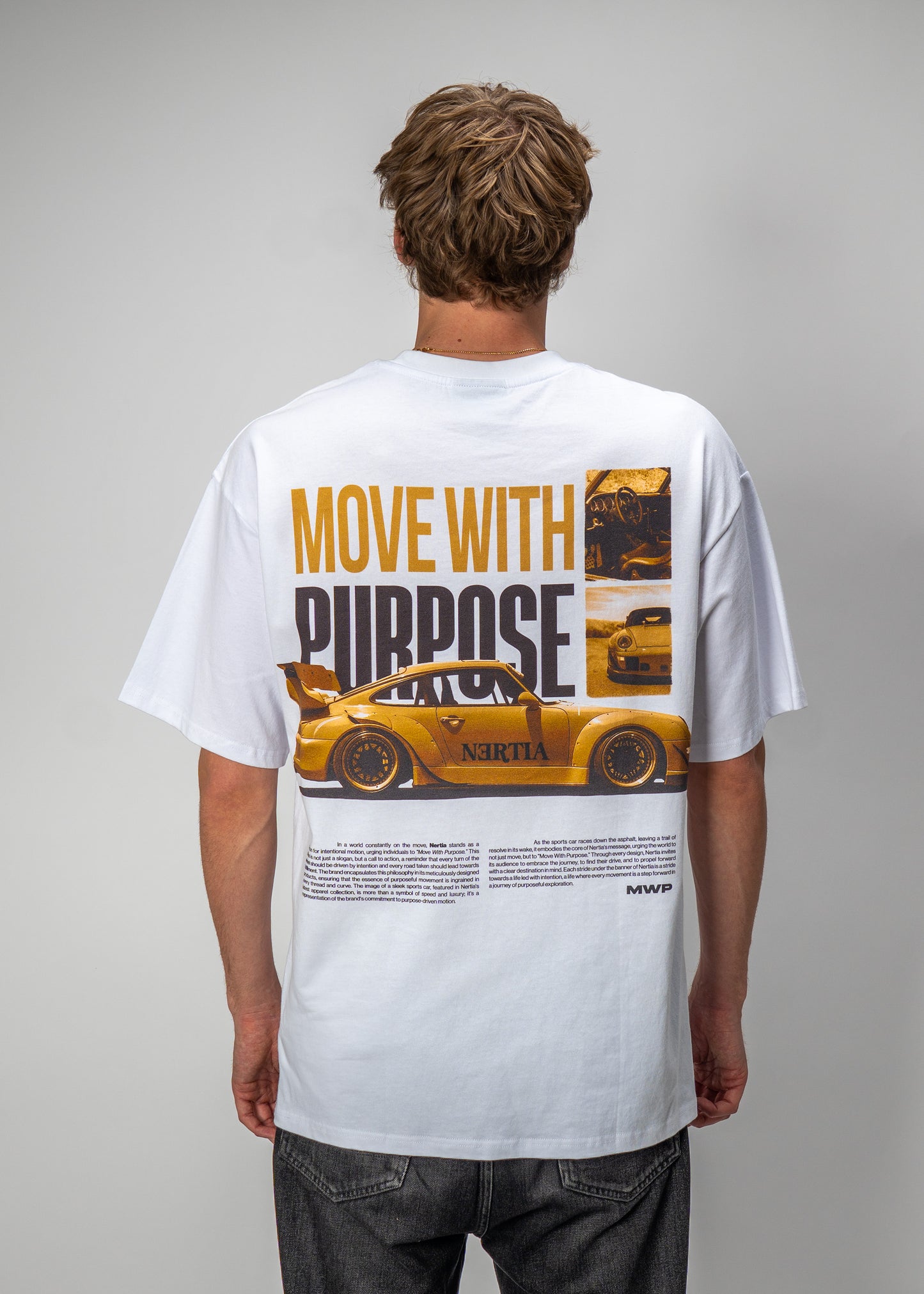 Person wearing a white t-shirt with a graphic design and text on the back.