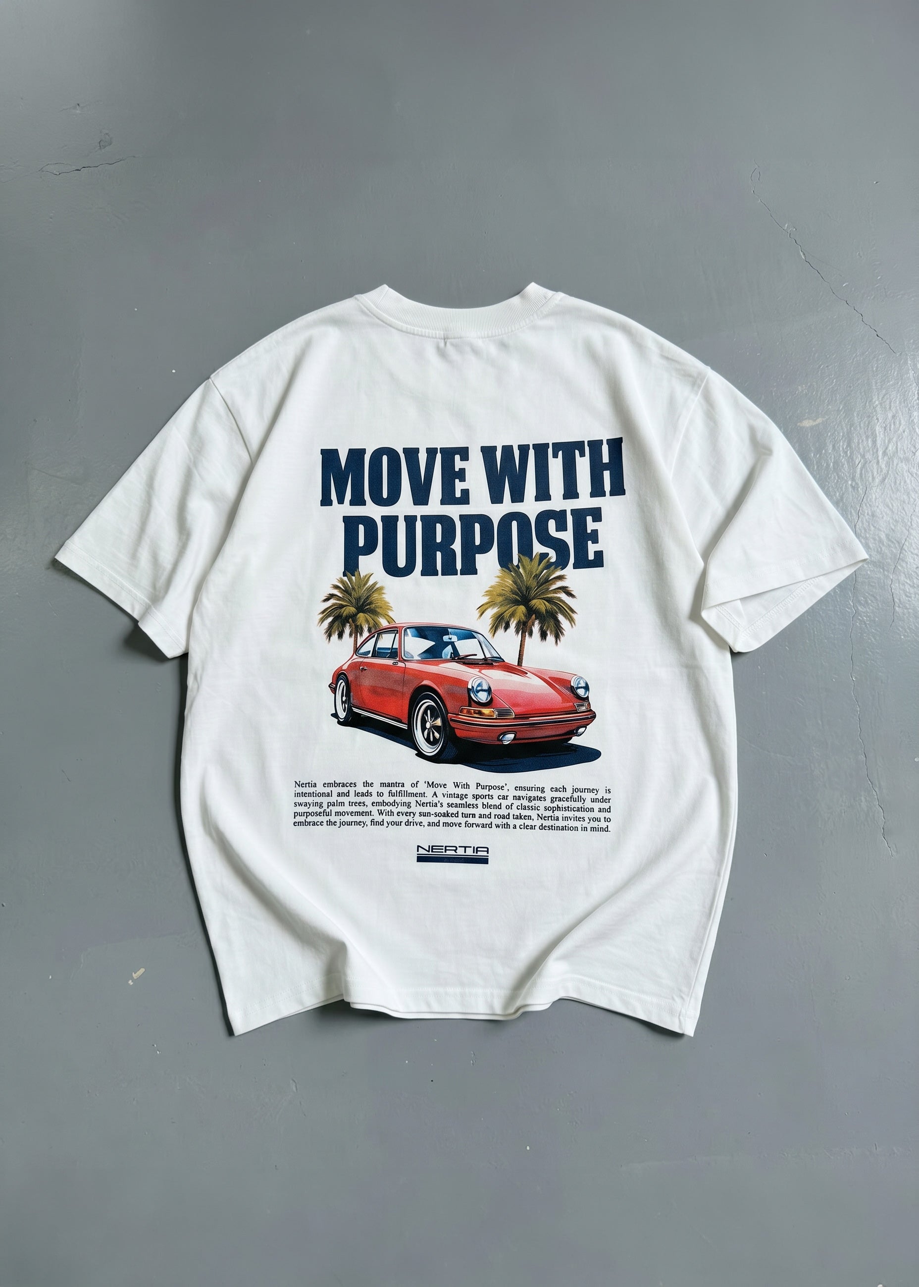 White t-shirt with a graphic of a red car and palm trees, featuring the text 'Move with Purpose' on a gray background.