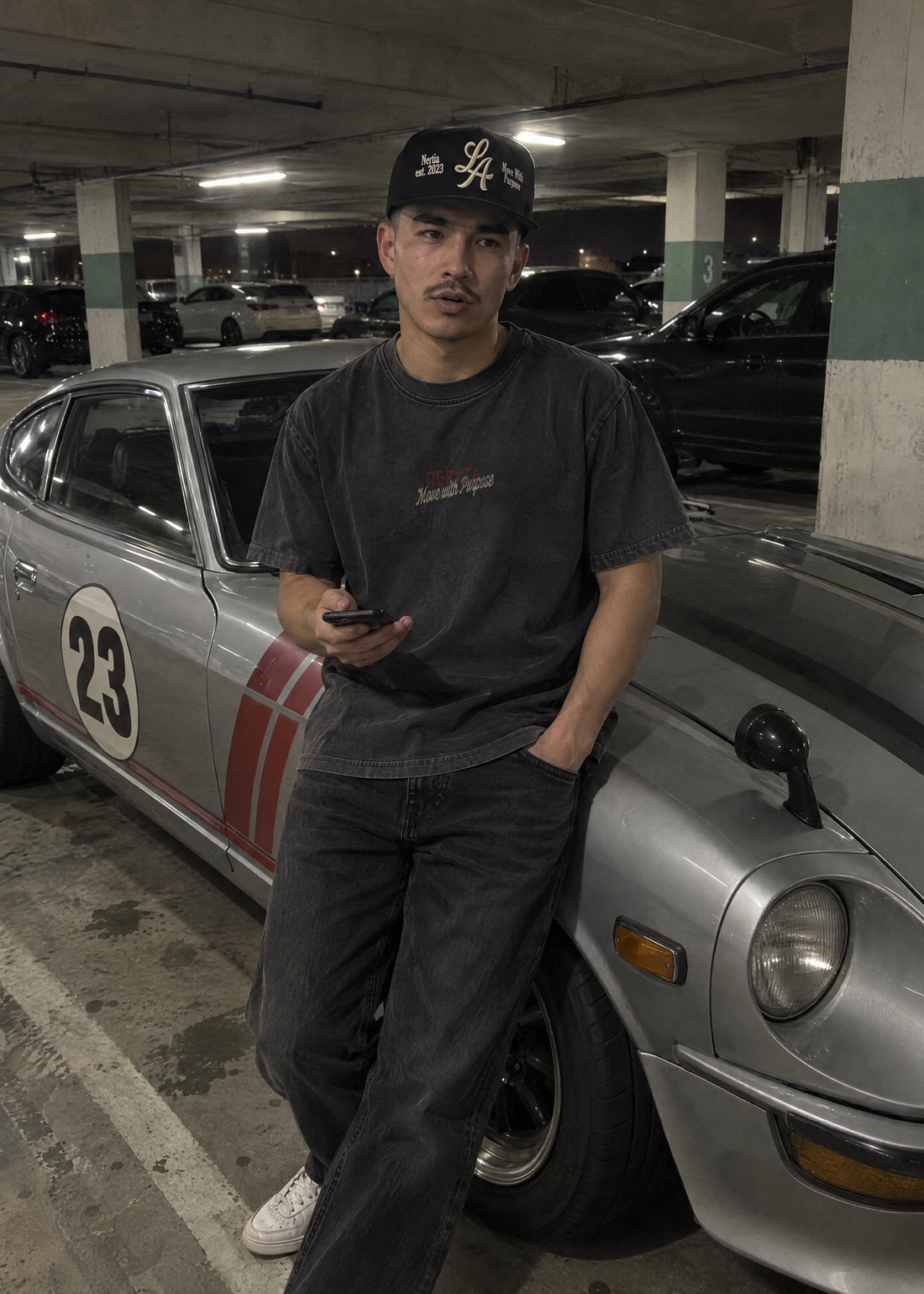 NERTIA S30 Racing Tee in washed black worn next to a silver Datsun 240Z (S30)